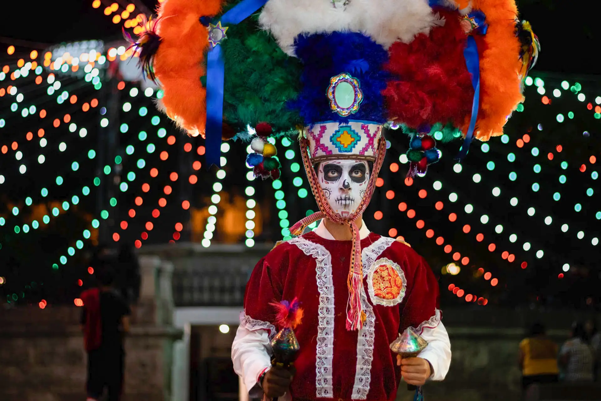 Hero main image of Guelaguetza del Tule festival in Santa María del Tule, Oaxaca, showing a vibrant scene of dancers in traditional costumes performing on stage with a lively audience